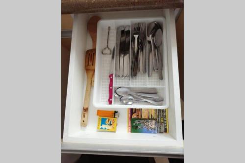 a drawer filled with lots of kitchen utensils at Any Mood! casa de descanso con Jacuzzi climatizado in Oaxtepec