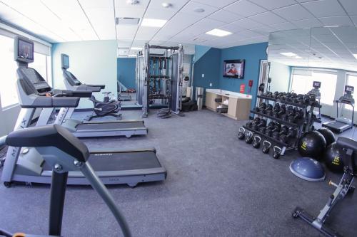 a gym with treadmills and machines in a room at avid hotel - Fresnillo by IHG in Fresnillo de González Echeverría