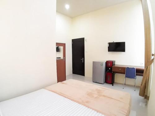 Televisyen dan/atau pusat hiburan di RedDoorz Syariah near Transmart Jambi 2