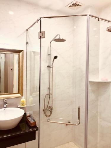 a bathroom with a shower and a sink at NEW CITY HOTEL in Tây Ninh