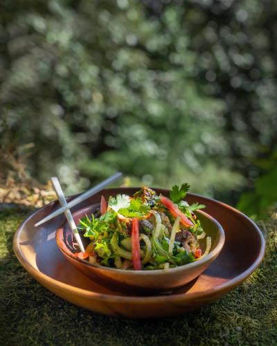 a bowl of food sitting on a table at Mary Budden Estate in Almora