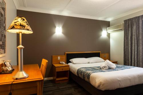 Postel nebo postele na pokoji v ubytování Country Motel Ipswich