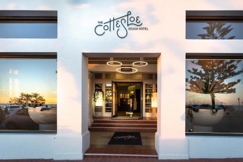 a store front with the entrance to a building at Cottesloe Beach Hotel in Perth