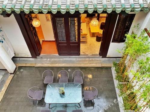 an overhead view of a table and chairs in front of a house at Chaozhou Hello Inn in Chaozhou