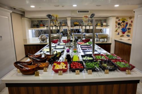 a buffet of food on a counter in a restaurant at Dosso Dossi Hotels Old City in Istanbul