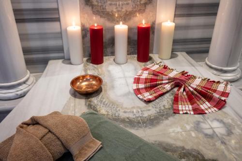 a group of candles and a bow tie on a table at Dosso Dossi Hotels Old City in Istanbul