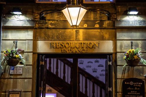 a sign over the door of a restaurant entrance at The Resolution Hotel in Whitby