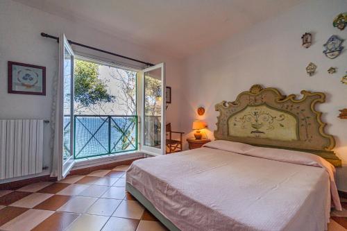 En eller flere senge i et værelse på Villa Il Tramonto - Goelba