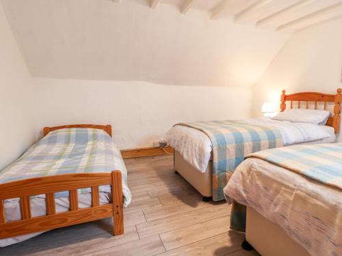 Ένα ή περισσότερα κρεβάτια σε δωμάτιο στο Stable Cottage, Narberth
