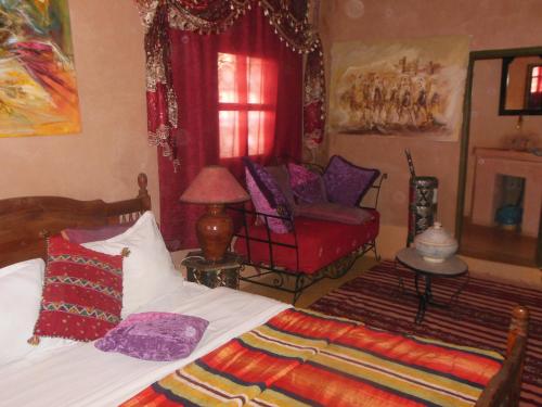 Ένα ή περισσότερα κρεβάτια σε δωμάτιο στο Kasbah du Peintre