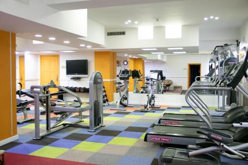 a gym with treadmills and cardio equipment in a room at Kempinski Hotel Khan Palace in Ulaanbaatar