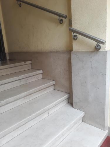 a set of stairs in a building with a railing at Casatitta Bed & Breakfast in Milan