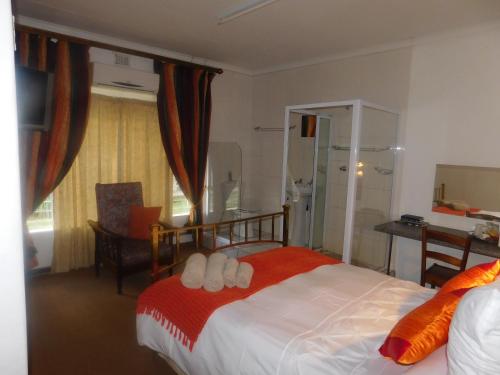 Postel nebo postele na pokoji v ubytování Fouriestreet 199 Bed and Breakfast