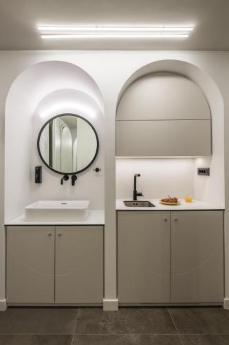 a bathroom with a sink and a mirror at Domus Ariadne in Heraklio