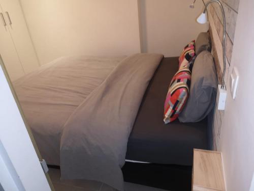 a bed in a small room with a bed sidx sidx sidx at Les terrasses de Malmédy in Malmedy