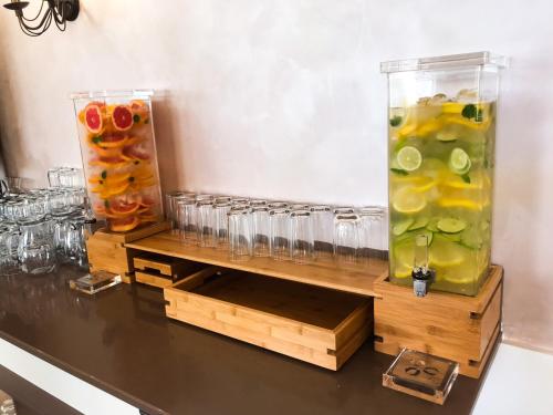 two vases filled with fruit on a table at Grand Hotel Pomorie - Medical spa in Pomorie