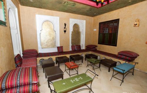 a room with chairs and tables in a building at El Kantaoui Center in Sousse