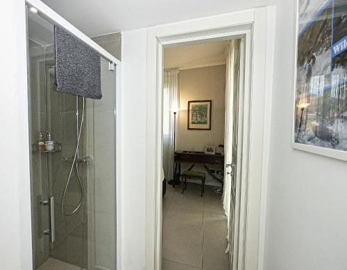 a bathroom with a walk in shower next to a walk in shower at Camera sopra il parco a 2 passi dal mare in Genoa