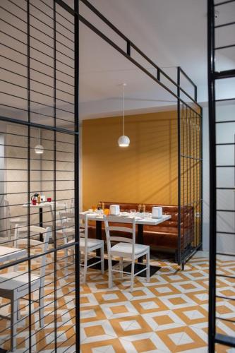 a dining room with a table and chairs at Four Rooms City in Kharkiv