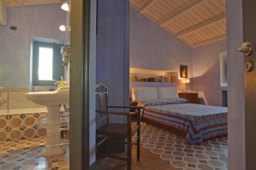Кровать или кровати в номере Villa con piscina vicino Cefalù (Sanificata)
