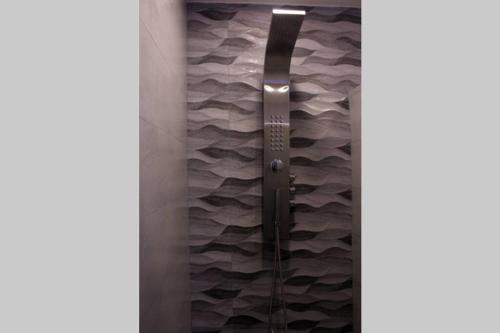 a shower with a glass door in a bathroom at Luxury Apartment in Nuevo Vallarta Villamagna Condo in Nuevo Vallarta 