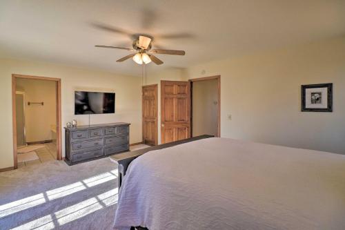a bedroom with a bed and a ceiling fan at Secluded Marble Falls Family Home with Mtn Views! in Marble Falls