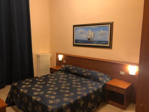 Postel nebo postele na pokoji v ubytování Hotel Paradiso