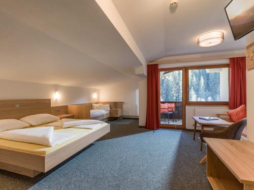 Postel nebo postele na pokoji v ubytování Haus am Wildbach