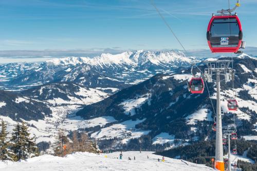 a ski lift going over a snow covered mountain at Haus am Wildbach in Auffach