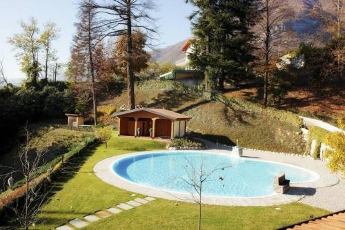a swimming pool in a yard with a gazebo at TREMEZZO RESIDENCE 2-1 of 11 apartments in an exclusive residence by Italian Apartments in Tremezzo
