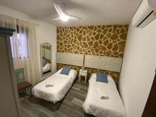 Postel nebo postele na pokoji v ubytování La Posada de Bartolo.