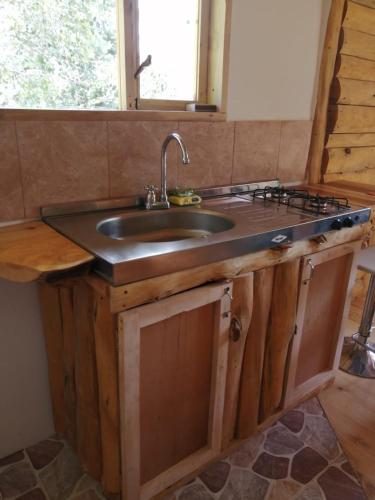 a kitchen with a sink and a counter top at La Arboleda in Tilatá