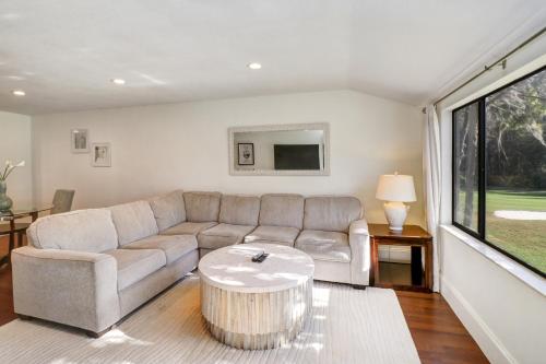 a living room with a couch and a table at Saddlebrook Golf Course view Condo with Kitchen in Wesley Chapel