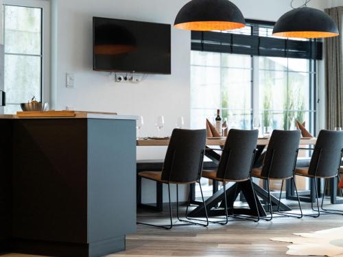 a dining room with a table and chairs at Apartment in St Johann im Pongau with sauna in Alpendorf