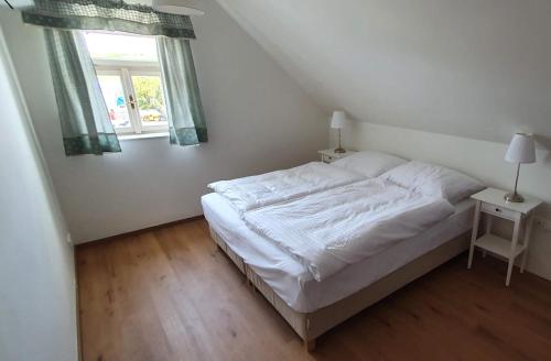 Apartmány Na Potokuにあるベッド