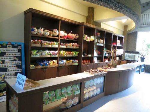 a bakery with a counter with different types of donuts at Ying Shih Guest House in Datong