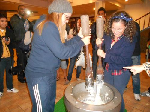 two women are standing next to a table with bottles at Ying Shih Guest House in Datong