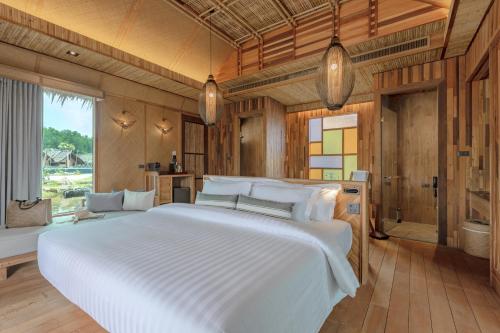 Ένα ή περισσότερα κρεβάτια σε δωμάτιο στο Venice Krabi Villa Resort