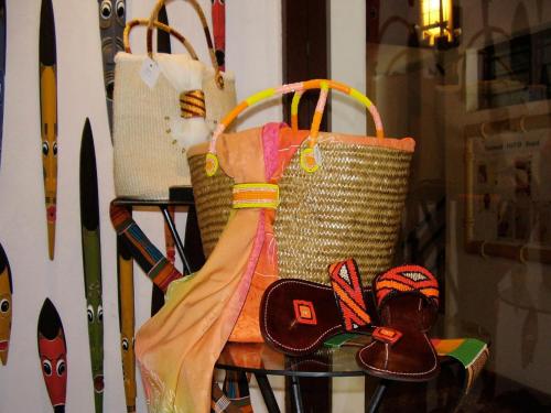 a group of bags and shoes on a table at Pinewood Beach Resort and Spa in Diani Beach