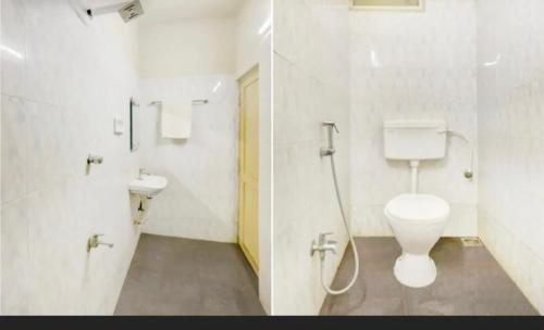 een badkamer met een toilet en een wastafel bij SAROVAR INN in Chennai