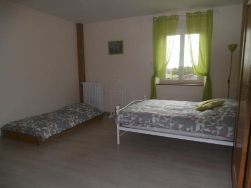 Katil atau katil-katil dalam bilik di Gîte aux Portes de l'Argonne