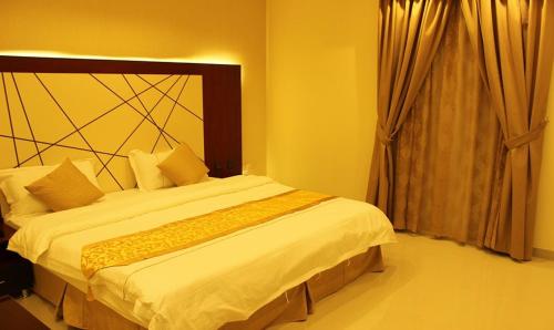 Кровать или кровати в номере Abat Suites
