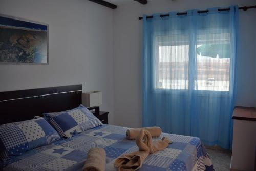 Postel nebo postele na pokoji v ubytování CA.MARCELA. 200 metros del mar.