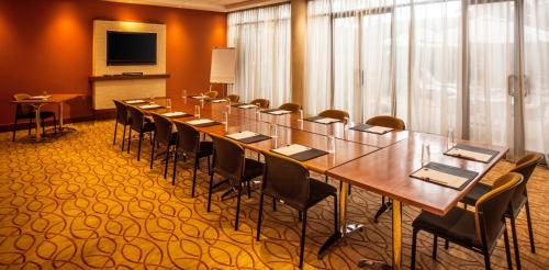 a large conference room with a long table and chairs at Garden Court Hatfield in Pretoria