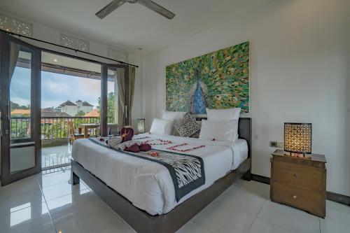 Postel nebo postele na pokoji v ubytování Iman Homestay Ubud