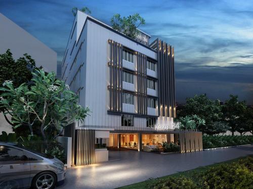 a rendering of a building with a car parked in front at The Kaze 34 Hotel and Serviced Residence in Bangkok