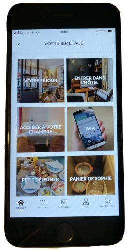 a tablet computer screen with a picture of a website at 1er Etage Marais in Paris