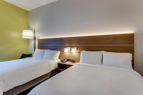 two beds sitting next to each other in a hotel room at Holiday Inn Express & Suites - Saugerties - Hudson Valley by IHG in Saugerties