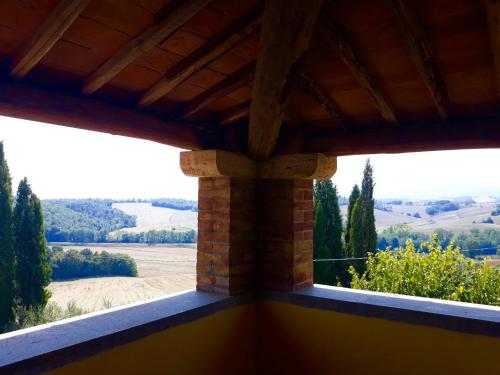 a view from the balcony of a house with a view at Villa Palazzo Bello con piscina e AC - Cetona in Cetona