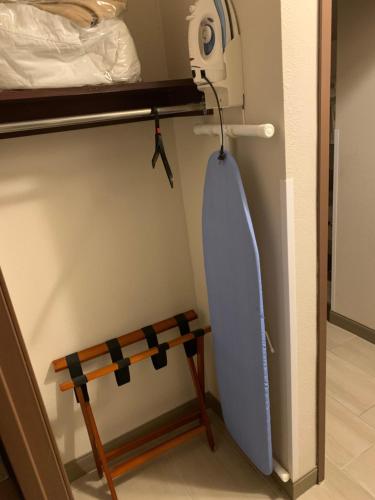 a surfboard hanging on a wall next to a bench at Wingate by Wyndham Brighton in Brighton
